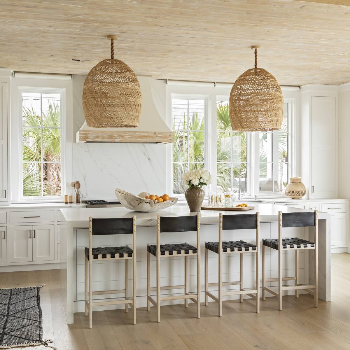 Custom kitchen with vaulted ceiling and coastal light