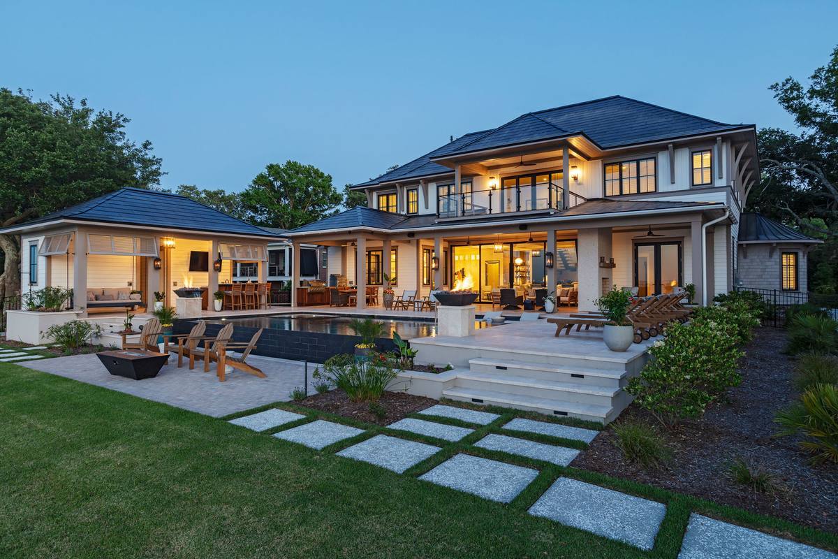 Modern waterfront custom home at dusk, built by Phillip Smith General Contractor