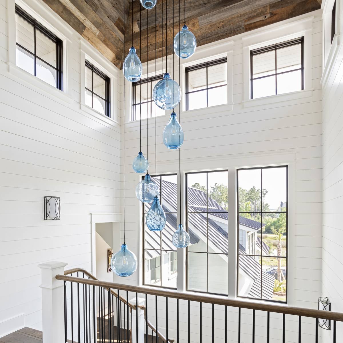 Reclaimed barn-wood stairwell ceiling, a family's history built into a Daniel Island custom home
