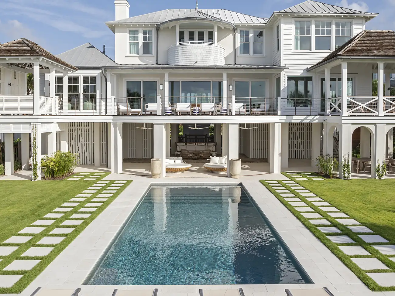 Full rear exterior with pool and paver-grid lawn, Isle of Palms Lowcountry Modern home