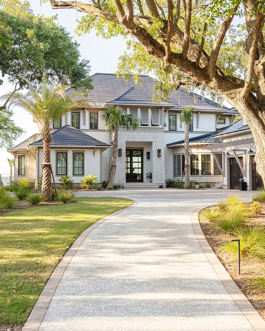 Tree-lined front approach to a custom Lowcountry home