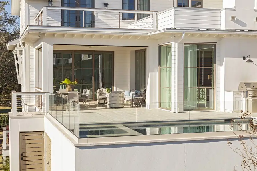 Elevated pool terrace with glass railing and outdoor kitchen, Sullivan's Island