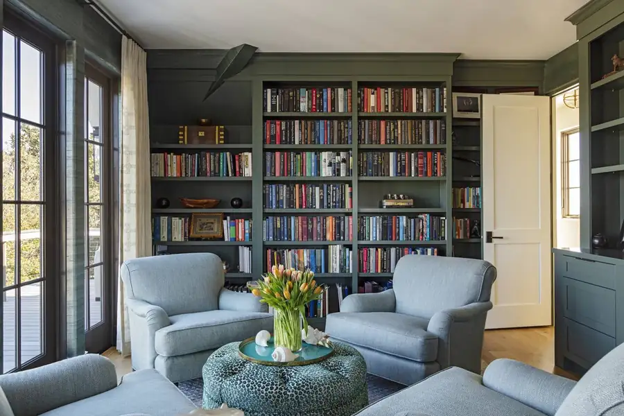 Home library with full bookshelves and reading chairs, Sullivan's Island