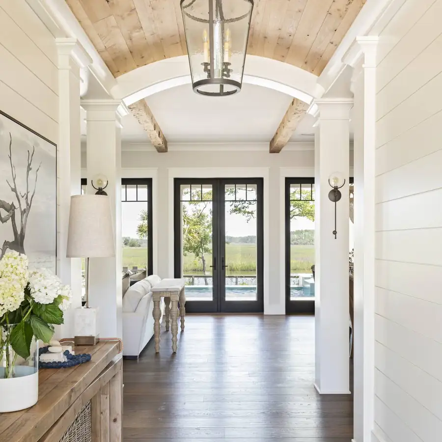 Barrel-vaulted wood ceiling opening to pool views, Daniel Island