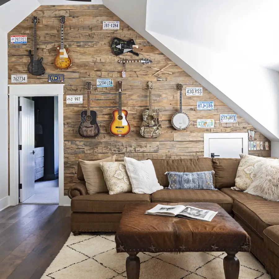 Media room wall displaying the homeowners' guitar collection
